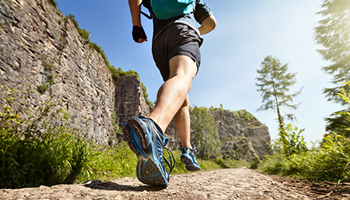 Man running on nature trail